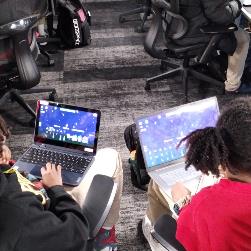 Photo of ShareIT students working to build a game 