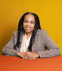 Headshot of JeMiah Israel on orange and yellow background