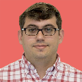 MatthewBadger Headshot of Matthew Badger with pink background
