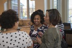 Three black women interacting