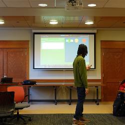 Image of Jermaine Giving Presentation on UI/UX 6